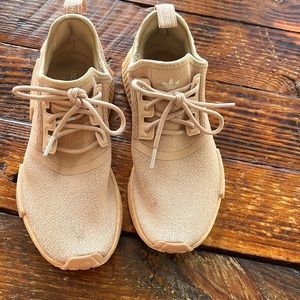Blush pink adidas NMDs